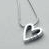 A contact sheet of seven animated frames showing a heart-shaped pendant necklace with subtle motion effects on a gray background.