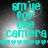Cyan pixelated text 'smile for the camera' with heart symbols below, on a grayscale gradient background.