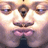 Pixelated close-up of a face with closed eyes, pink lips, and dark clothing against a light background.