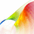 A colorful abstract animation of flowing gradient shapes in red, orange, yellow, green, and blue against a white background.