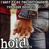 A pixelated image shows two people holding hands, with overlaid text reading "I WANT TO BE THE ONLY HAND YOU EVER NEED TO hold on to".