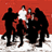 A 48x48 pixel animated buddy icon featuring a group of silhouetted figures against a red background with green text on the right side reading "Original Icons .com".