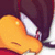 Animated pixel art of a character with dark hair and orange face, showing subtle head movement across frames.