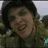 A pixelated image shows a person in military-style clothing with a blurred background, next to red text reading WHAT!?!