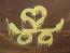 Static yellow icon with abstract looping shapes on brown background, resembling a stylized Chinese character or calligraphic symbol.