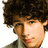 Pixelated image of a person with curly brown hair and light skin, next to text reading "I LUV <3 <3 NICK!! <3 <3" in bold black letters.