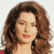 Static pixelated image of a woman with long brown hair and closed eyes, rendered in low-resolution style typical of early 2000s AIM buddy icons.
