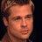 Static pixelated image of a person's face with brown hair and light skin tone against dark background.