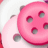 A pink circular icon with five dark gray oval spots, two small rounded ears on top left and bottom left, and a white background.