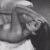 A grayscale static icon shows a person with dark hair and a light-colored top, viewed from the side with a blurred background.