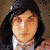 A 2x2 contact sheet of three animated frames showing a person with long dark hair and red eye makeup in different outfits against varied backgrounds, displayed on a gray transparency background.