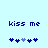 Pixelated blue text 'kiss me' on light blue background with five heart symbols below, two hearts shift position between frames.