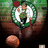 Pixelated static image shows a figure in green and white attire holding a dark object against a blurred background with brown, green, and red tones.