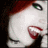 A pixelated close-up of a person with red hair and green eyes, showing two distinct mouth positions in an animated sequence.