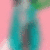 A blurry turquoise figure with dark circular eyes and a green top against pink background, showing subtle pixel shifts between frames.