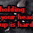 Red text on dark background with metallic objects and a gray rectangle.