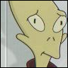 Yellow-skinned cartoon character with large eyes, downturned mouth, and pointed nose, wearing dark red clothing against light background.