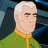 Pixelated image of a character with white hair, light skin, and a green outfit with a yellow collar, set against a dark blue background.
