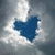 Cloudy sky background with blue heart shape; animated text and symbols appear sequentially.