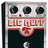 Pixelated image of a guitar effects pedal with red text and orange digital-style text on black background.