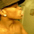 A pixelated figure with a hat and earrings in profile view, showing subtle facial expression changes across frames.