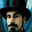Pixelated portrait of a man with dark mustache and goatee wearing black top hat, set against blue background on left; red block on right contains partial text.