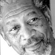 Black-and-white pixelated static image of a human face with visible facial features and grayscale shading.