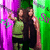 Two figures stand side-by-side against a green and purple background with 'Halloween 09' text; the lower figure's head shifts slightly leftward.