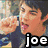 A static image of a person with dark hair and a blue shirt making a fist gesture, labeled 'joe' below.