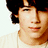 A pixelated image of a person with dark hair wearing a light-colored shirt, overlaid with text blocks reading "Im Burning up Burning up" and "For you LEXII".