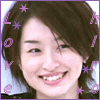 A 2x2 contact sheet of four animated frames showing a person with brown hair and pink lips smiling, surrounded by purple text and stars on a gray background.