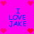 Pixelated graphic with bright pink background, red heart symbols at corners and center, blue text "I LOVE JAKE" repeated four times in