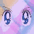Pixelated anime-style eyes in four variations showing open, half-closed, and closed states against pastel pink and blue background.