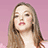A static image with a pink background, featuring a person on the left and green pixelated text blocks on the right.