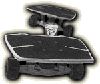 Two identical grayscale cartoon vehicles with rounded roofs and white trim, each featuring a small figure with a white face and dark hair inside the driver's seat.