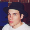 A four- shows a person in various poses: wearing a dark hat and white shirt, holding a red-topped object, with a blurred background