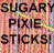 Static pixelated image with bold black text reading "SUGARY PIXIE STICKS!" on a multicolored gradient background of pink, orange, and yellow tones.