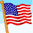 Nine pixelated American flags on wooden poles, each waving differently against light blue sky with white clouds.