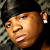 A 50x50 pixel animated contact sheet showing two frames of a person with dark hair wearing a black cap and earring, against a textured background.