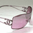 Pixelated image of pink-tinted sunglasses on a white surface with a bright purple background and white text reading "Emily 03's Her Kanye Weezy's!".