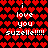 Red heart pattern background with white text repeating 'i love you suzelle!!!!!' in pixelated font across the image.