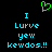 Green pixelated heart symbol above blue text reading 'I Lurve yew kewdos.!!' on black background.