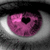 A pixelated eye with a pink iris featuring a black heart-shaped pupil, set against a grayscale background with dark upper and lower regions.