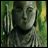 Pixelated image of a figure with long hair and a blurred green background, alongside stylized text reading "AnimeIM" and "com" on a black background.