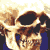 Pixelated image of a human skull with dark eye sockets and nasal cavity, wearing blue clothing against a light background.