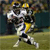 Pixelated static image of a football player in motion on a field, wearing a helmet and uniform with yellow accents.