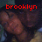 A four- shows a person with dark hair and light skin in a yellow top, with red text above each reading 'brooklyn', 'meets', 'harlem', and a blank space
