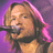 Static pixelated image of a person singing into a microphone with pink and purple background elements.