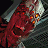 Pixelated image of a demonic figure with red skin and glowing eyes next to fiery 'DOOM' text on black background.