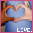 Pixelated static image of two hands forming a heart shape with blue background and white text reading .LOVE. at the bottom.